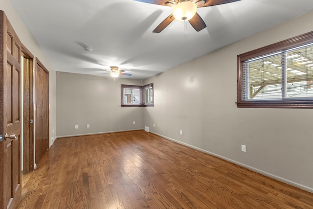 unfurnished bedroom featuring ceiling fan and wood-type flooring