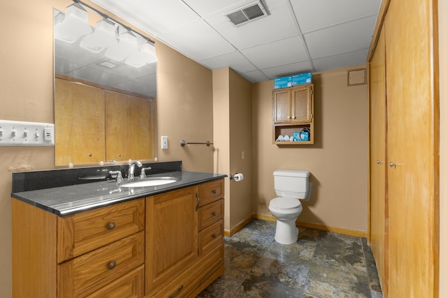 bathroom with toilet and vanity