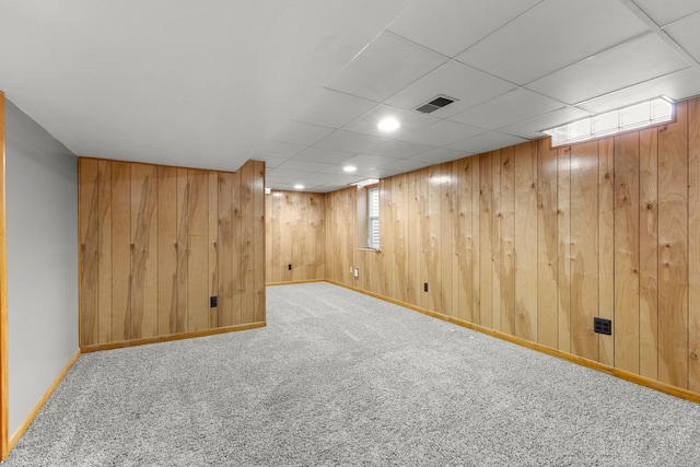 basement with a wealth of natural light and carpet