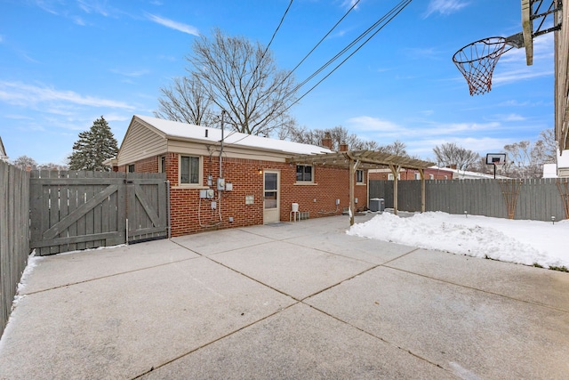 rear view of property with cooling unit and a pergola