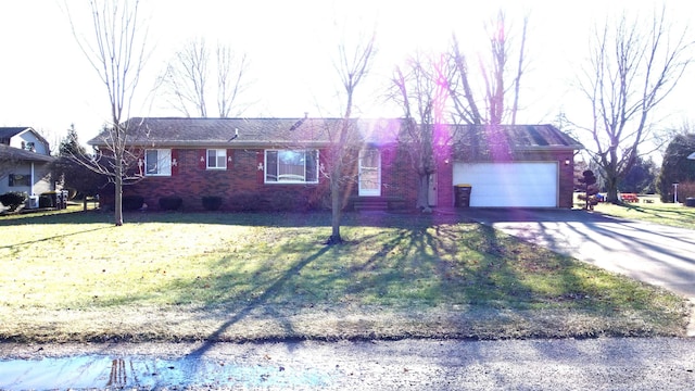 single story home with a front lawn and a garage