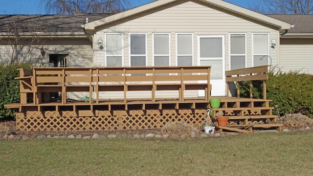 back of property with a wooden deck