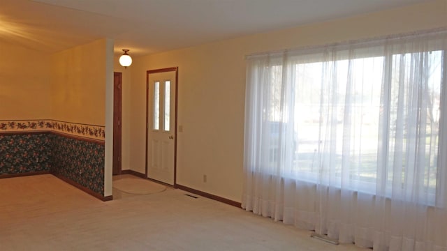 entrance foyer with carpet floors