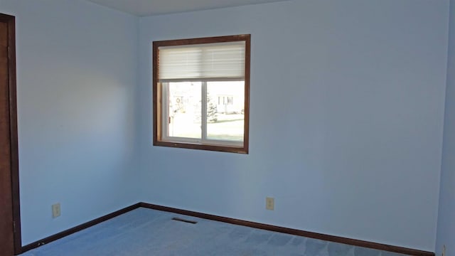 view of carpeted spare room