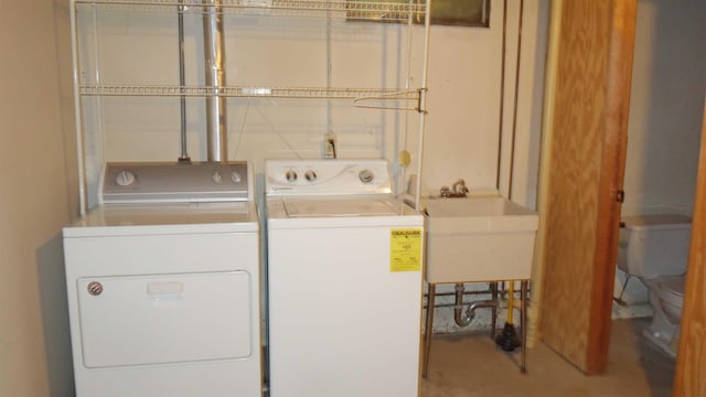 laundry room with independent washer and dryer and sink