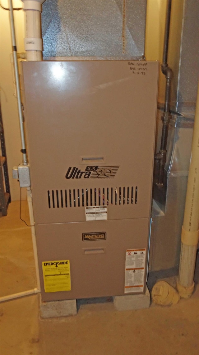 utility room with heating unit