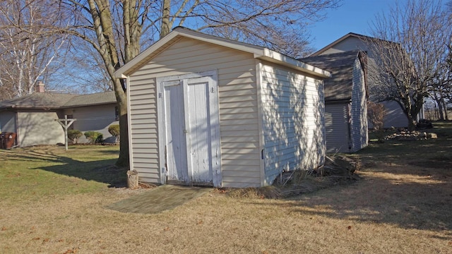 view of outdoor structure with a lawn