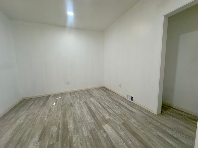 spare room featuring light wood-type flooring