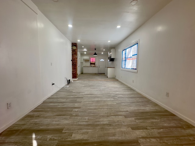 unfurnished living room with light hardwood / wood-style floors