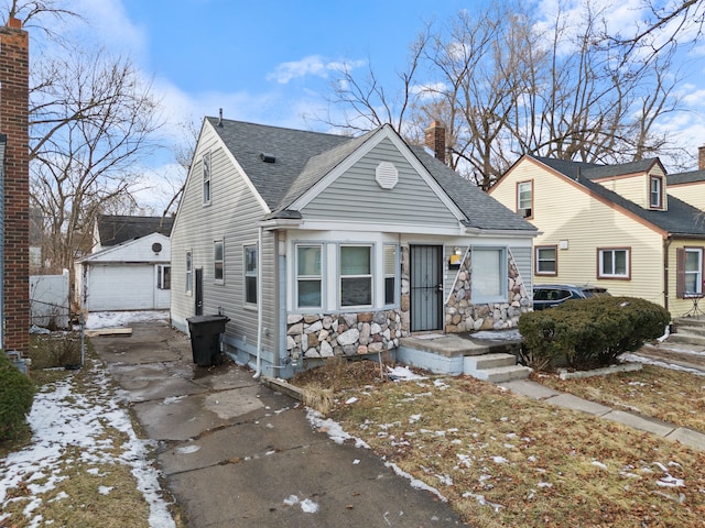 view of front of house with an outbuilding and a garage