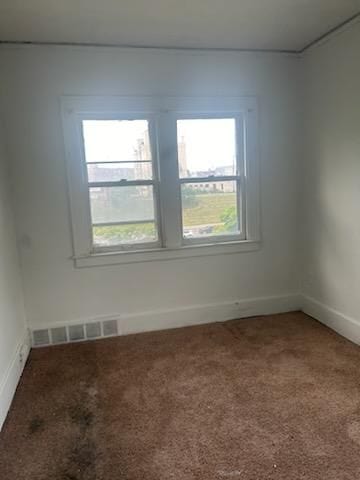 spare room with carpet flooring