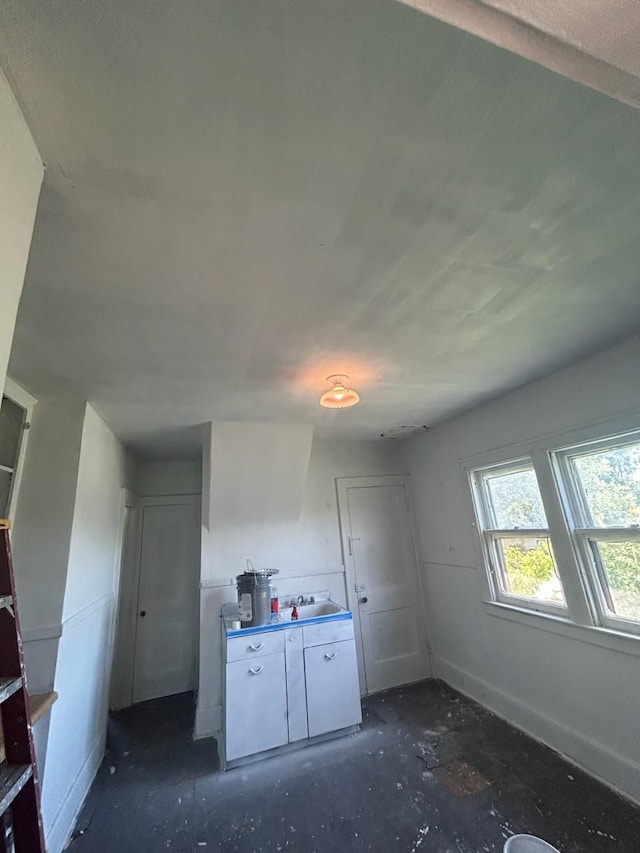 kitchen featuring white cabinets and sink