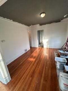 unfurnished room featuring hardwood / wood-style flooring