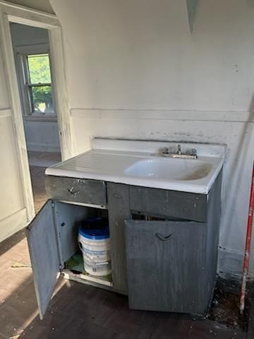 bathroom with hardwood / wood-style floors and sink