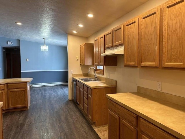 kitchen with stainless steel dishwasher, sink, decorative light fixtures, an inviting chandelier, and dark hardwood / wood-style floors