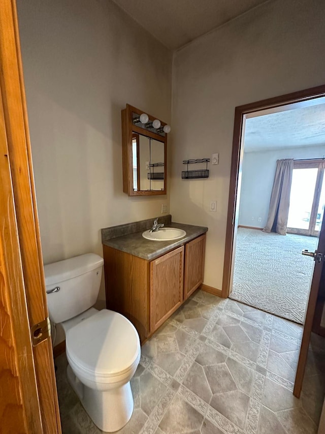 bathroom with vanity and toilet