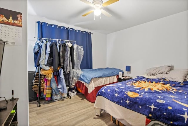 bedroom featuring hardwood / wood-style flooring and ceiling fan