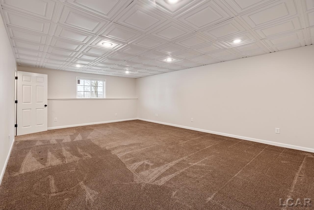 unfurnished room featuring dark carpet