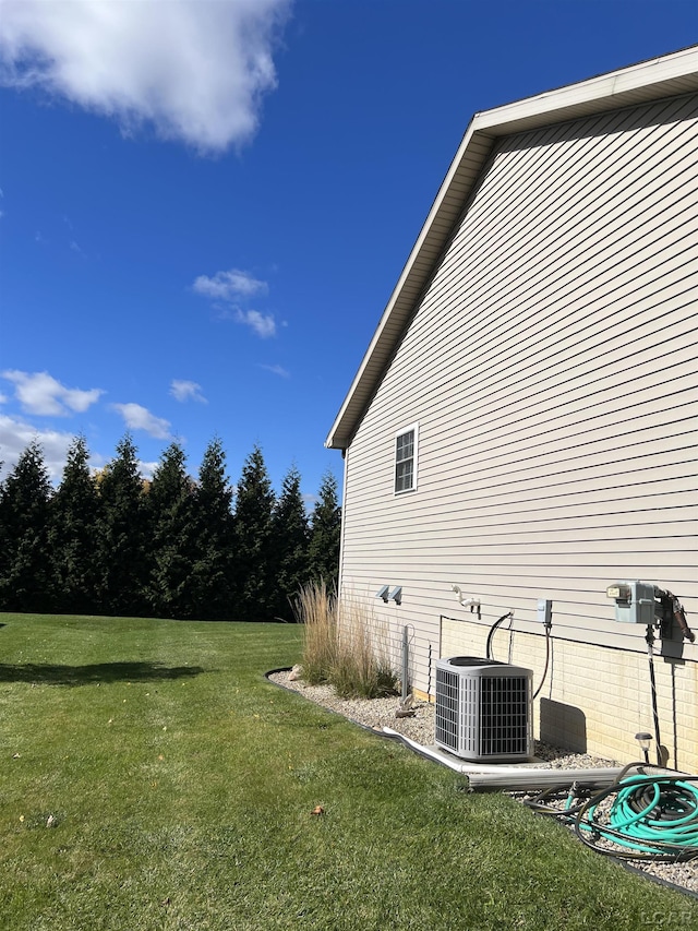 view of yard with central AC unit