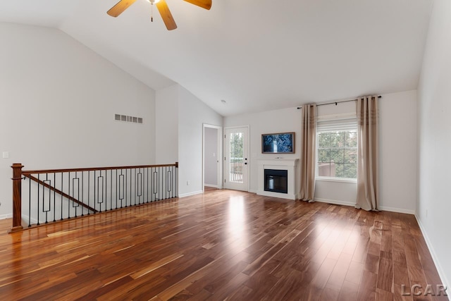 unfurnished living room with hardwood / wood-style flooring, ceiling fan, and lofted ceiling