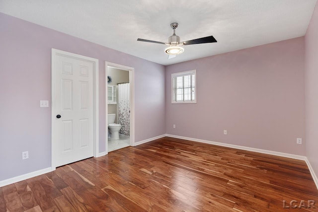 unfurnished room featuring dark hardwood / wood-style flooring and ceiling fan