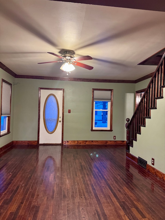 entrance foyer with crown molding, dark hardwood / wood-style floors, and ceiling fan