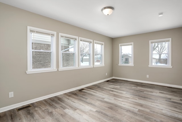 empty room with light wood-type flooring