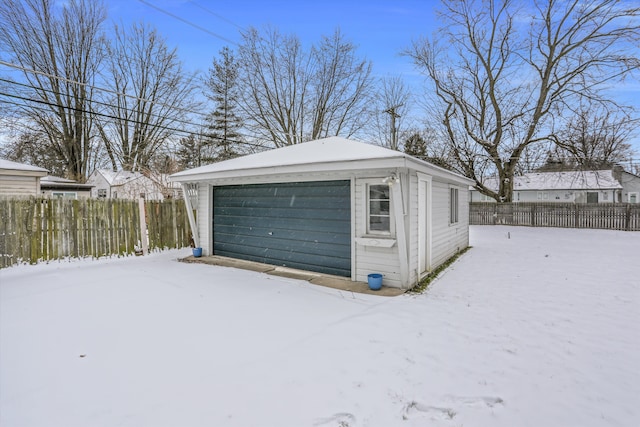 view of snow covered garage