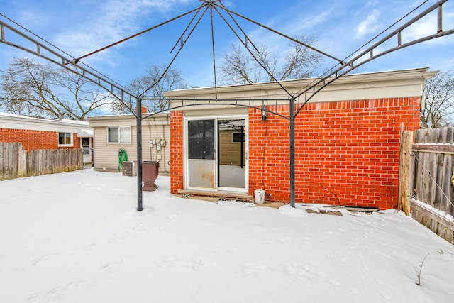 view of snow covered house