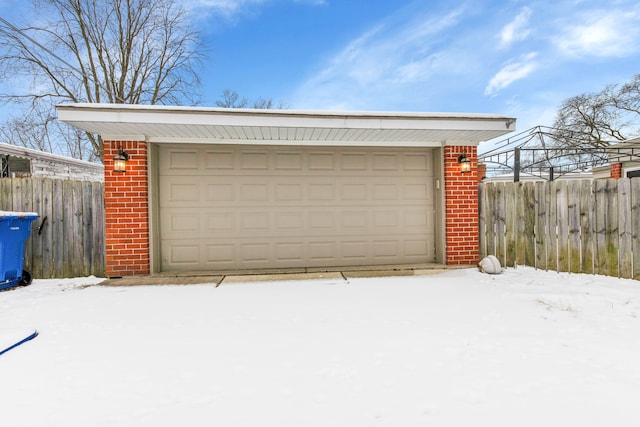 view of snow covered garage