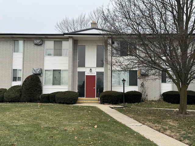 view of property with a front lawn