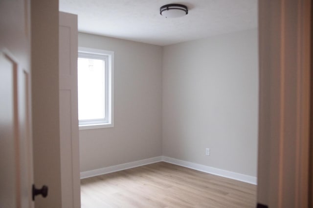 empty room with light wood-type flooring