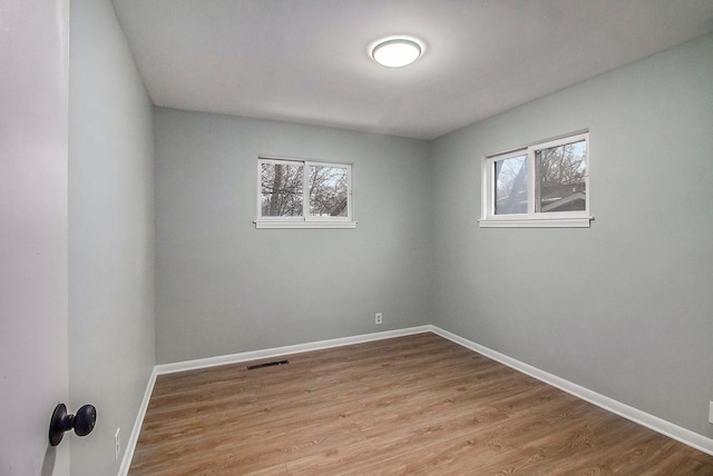 unfurnished room with light hardwood / wood-style floors