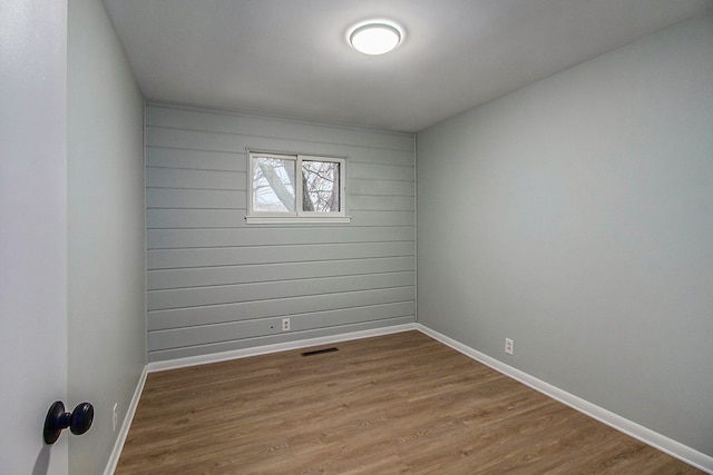 unfurnished room with light hardwood / wood-style flooring