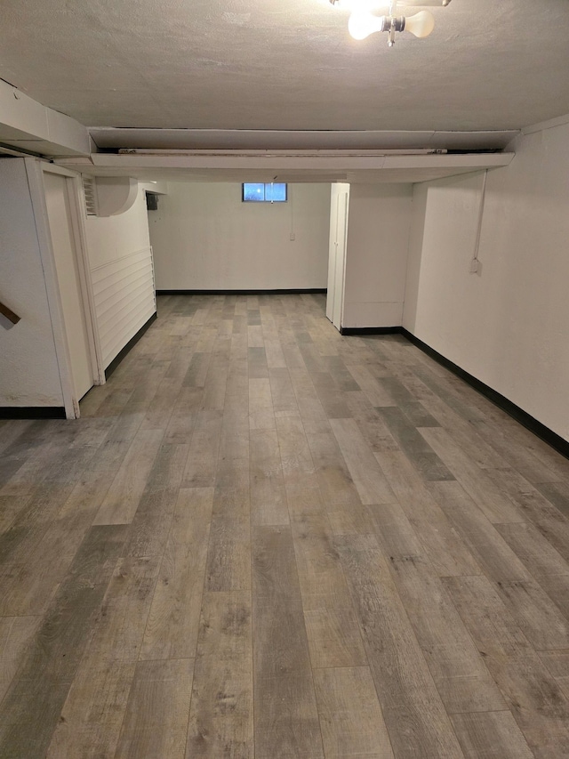 basement with wood-type flooring