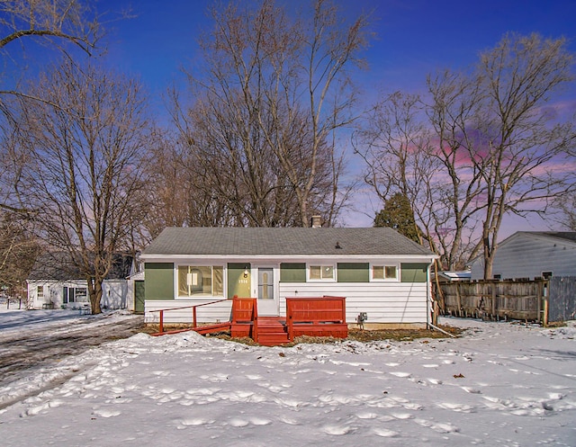 view of front of property featuring fence