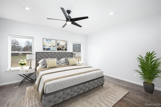 bedroom with dark wood-type flooring and ceiling fan