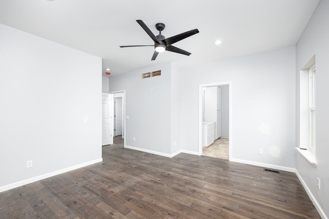 spare room featuring ceiling fan and dark hardwood / wood-style flooring