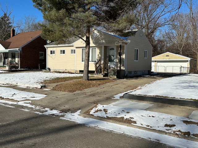 bungalow-style house with an outdoor structure and a garage