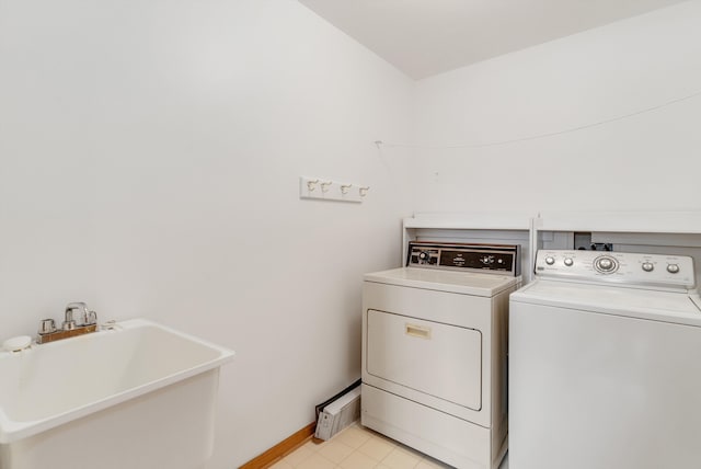 laundry area featuring sink and washing machine and dryer