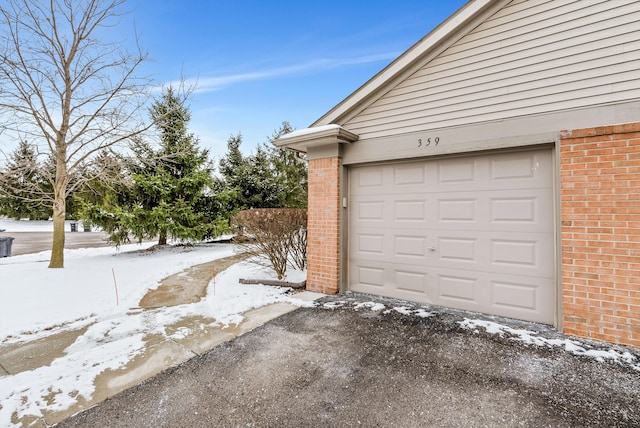 view of snow covered garage