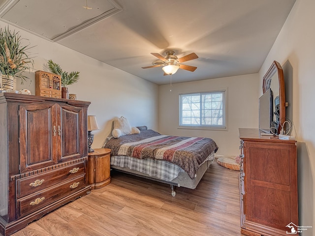 bedroom with ceiling fan and light hardwood / wood-style floors