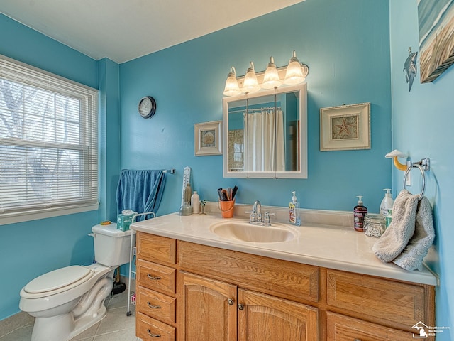 bathroom with walk in shower, tile patterned flooring, vanity, and toilet