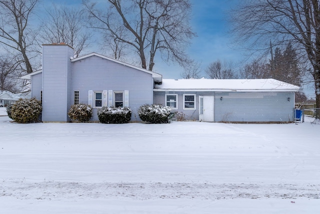 view of snow covered house