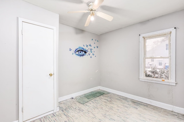 unfurnished room with ceiling fan