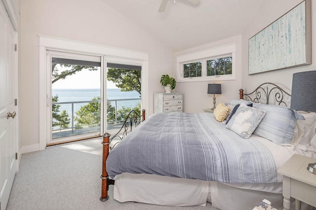 bedroom with lofted ceiling, ceiling fan, a water view, access to exterior, and carpet flooring