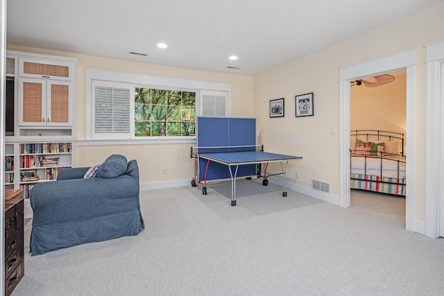 interior space with baseboards, recessed lighting, visible vents, and light colored carpet