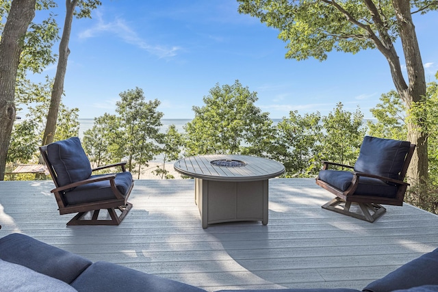 wooden terrace with a fire pit
