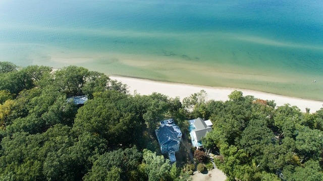 bird's eye view featuring a water view and a beach view