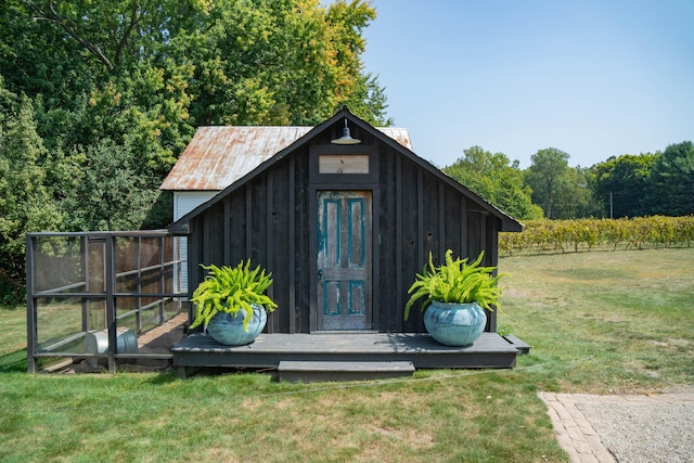 view of outdoor structure with a lawn